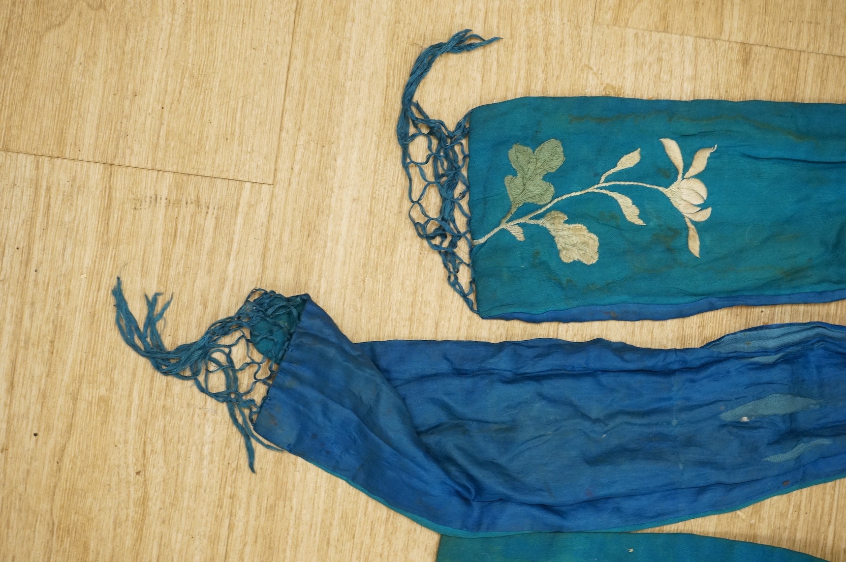 A collection of Chinese and Japanese embroidered kimonos and textiles